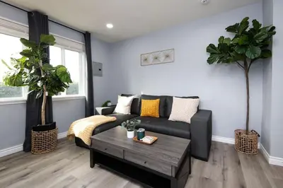 a living room with a couch and a coffee table at Lovely 3bedroom condo with free parking on premise in Los Angeles