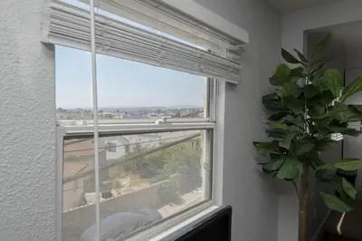 a window with a view of a city at Lovely 2bedroom condo with free parking on premise in Los Angeles