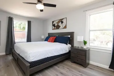 a bedroom with a bed and a ceiling fan at Lovely 2bedroom condo with free parking on premise in Los Angeles