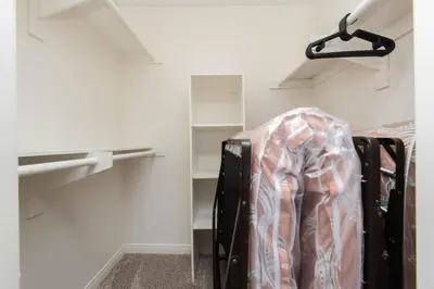a room with a closet with shelves and a suitcase at Hollywood 2Bed Apt w Rooftop pool & Panoramic View in Los Angeles