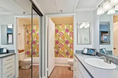 a bathroom with a sink and a toilet and a shower at Hollywood 2Bed Apt w Rooftop pool & Panoramic View in Los Angeles