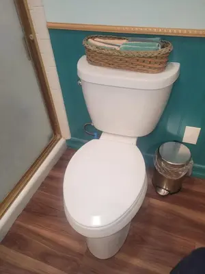 a bathroom with a toilet with a basket on top at Urban Farm House +Hot Tub+Pool in Long Beach