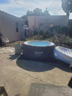 a large inflatable tub sitting in a yard at Urban Farm House +Hot Tub+Pool in Long Beach