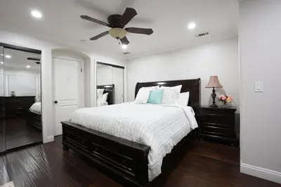 a bedroom with a bed and a ceiling fan at Destination #06 in Anaheim