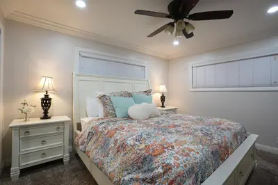 a bedroom with a bed and a ceiling fan at Destination #06 in Anaheim