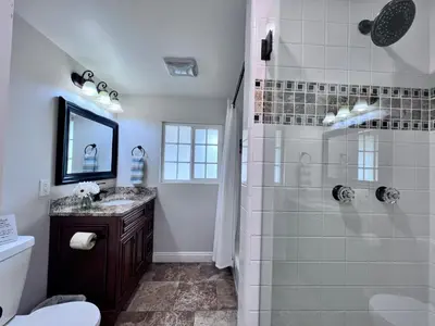 a bathroom with a shower and a sink at Destination #04 in Anaheim