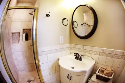 a bathroom with a sink and a shower at Destination #10 in Anaheim