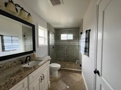 a bathroom with a sink and a toilet and a shower at Destination #23 in Anaheim
