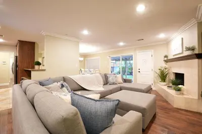 a living room with a couch and a fireplace at Destination #08 in Anaheim