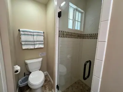 a bathroom with a toilet and a shower at Destination #12 in Anaheim