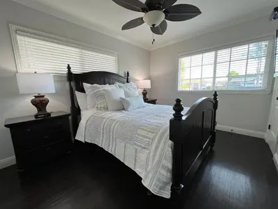 a bedroom with a bed and a ceiling fan at Destination #12 in Anaheim