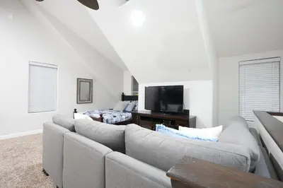 a living room with a couch and a tv at Nostalgic PoolJacuzzi Home: GameRm1.8 Mi 2Disney in Anaheim