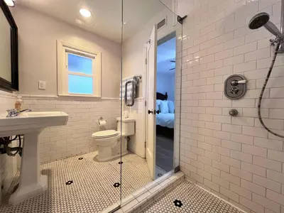 a bathroom with a shower and a toilet and a sink at Destination #13 in Anaheim