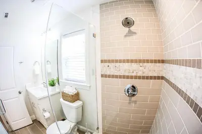 a bathroom with a toilet and a shower at Destination #37 in Fullerton