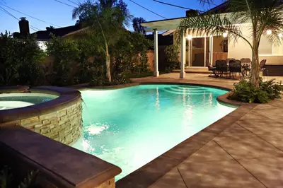 a swimming pool in a yard with a patio and a house at Destination #05 in Anaheim