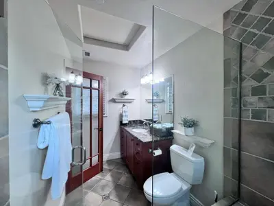 a bathroom with a toilet and a shower and a sink at Destination #09 in Anaheim