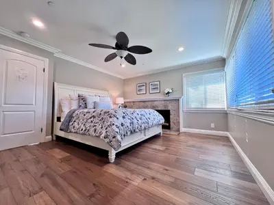 a bedroom with a bed and a ceiling fan at Destination #21 in Anaheim