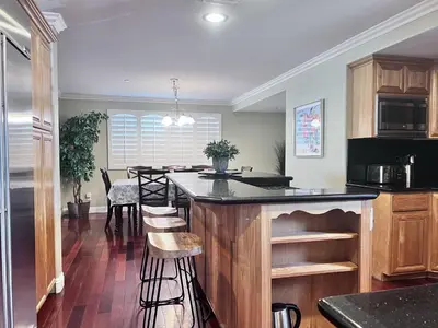 a kitchen with a island in the middle of a room at Destination #16 in Anaheim