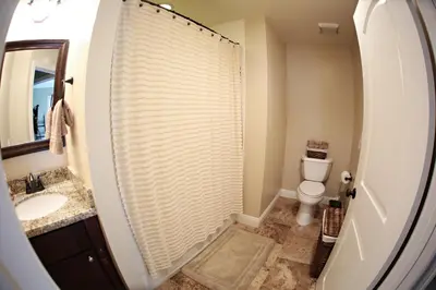 a bathroom with a shower and a toilet and a sink at Destination #26 in Anaheim