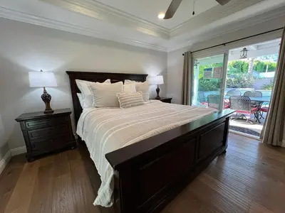 a bedroom with a large bed and a large window at Destination #29 in Anaheim