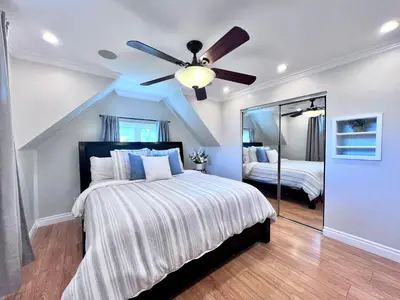 a bedroom with a bed and a ceiling fan at Destination #36 in Anaheim