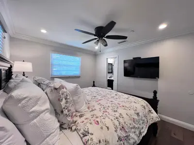 a bedroom with a bed and a ceiling fan at Destination #30 in Anaheim