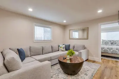 a living room with a couch and a table at Destination #43 in Orange