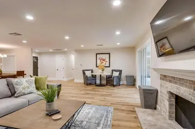 a living room with a couch and a fireplace at Destination #43 in Orange