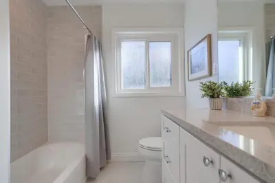 a bathroom with a tub and a toilet and a sink at Destination #46 in Fullerton