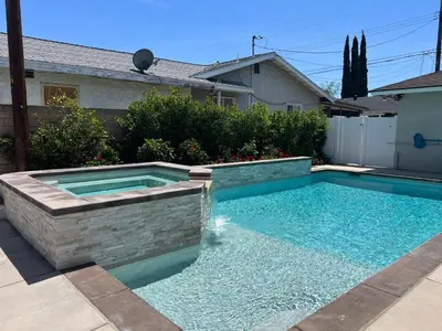 a swimming pool in front of a house at Destination #46 in Fullerton