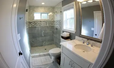 a bathroom with a sink and a toilet and a mirror at Destination #31 in Anaheim