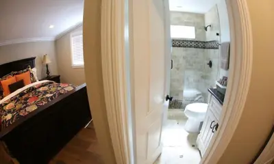 a bathroom with a bed and a shower and a toilet at Destination #31 in Anaheim