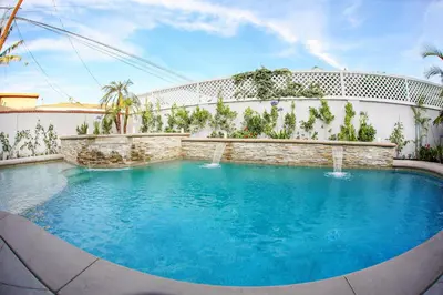 a swimming pool in front of a building at Destination #32 in Anaheim