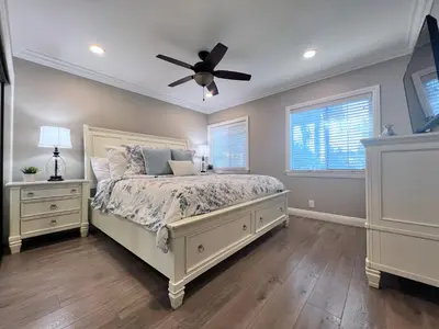 a bedroom with a bed and a ceiling fan at Destination #32 in Anaheim