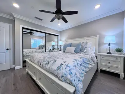a bedroom with a bed and a ceiling fan at Destination #32 in Anaheim
