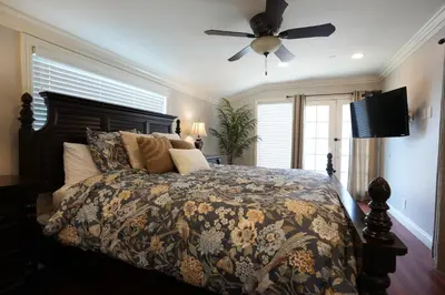 a bedroom with a bed and a ceiling fan at Destination #25 in Anaheim
