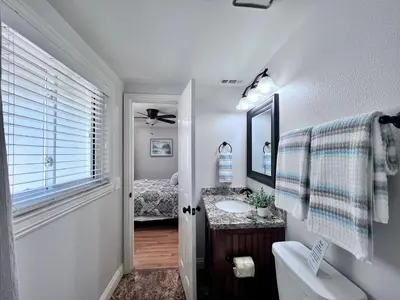 a bathroom with a sink and a mirror at Destination #25 in Anaheim