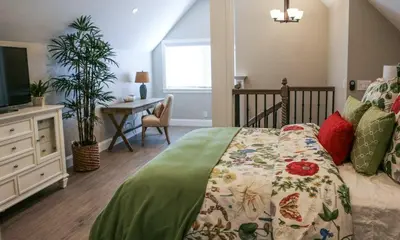 a bedroom with a bed and a desk and a television at Destination #34 in Santa Ana