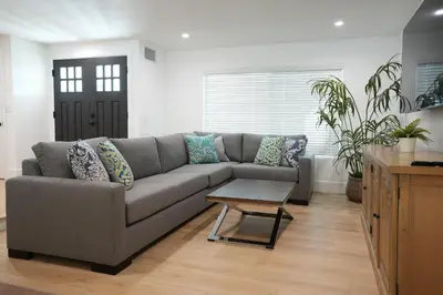 a living room with a couch and a table at Destination #50 in Placentia