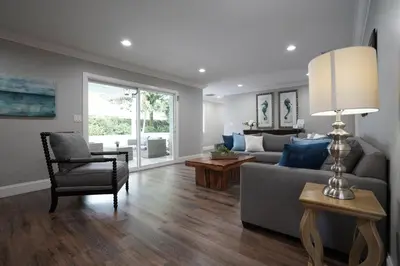 a living room with a couch and a chair at Destination #39 in Orange