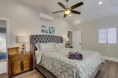 a bedroom with a bed and a ceiling fan at Destination #41 in Fullerton