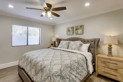 a bedroom with a bed and a ceiling fan at Destination #41 in Fullerton