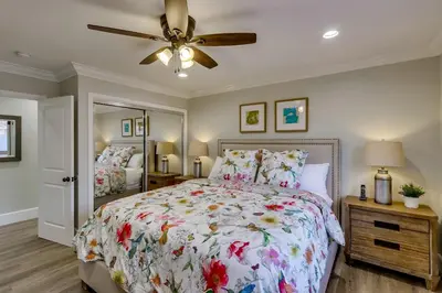 a bedroom with a bed and a ceiling fan at Destination #41 in Fullerton