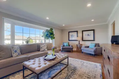 a living room with a couch and a table at Destination #44 in Orange