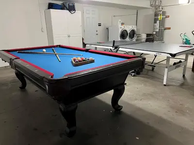 a pool table in a room with two ping pong tables at Destination #48 in Placentia