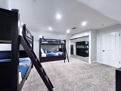 a bedroom with two bunk beds and a mirror at Destination #01 in Anaheim