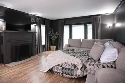 a living room with a couch and a fireplace at Destination #51 in Santa Ana