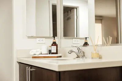 a bathroom counter with a sink and a mirror at Beautiful Studio in West Hollywood in Los Angeles