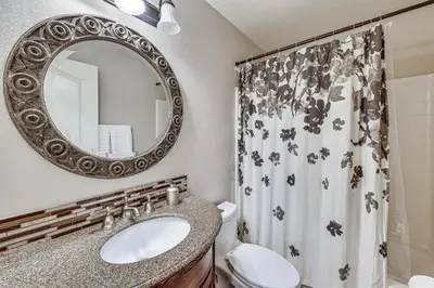 a bathroom with a sink and a mirror at Large Rancho Cucamonga Home 5 Mi to Red Hill Park in Rancho Cucamonga