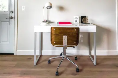 a white desk with a chair and a lamp at Family Getaway Villa to Disneyland! Sleeps up to 22 persons w Game Room, Pool Table & EV Friendly in Midway City